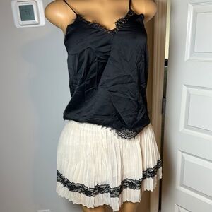 Elegant Cream Pleated Skirt with Black Lace Trim